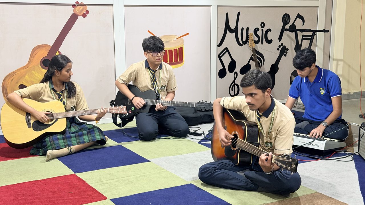 Students playing music in the music room